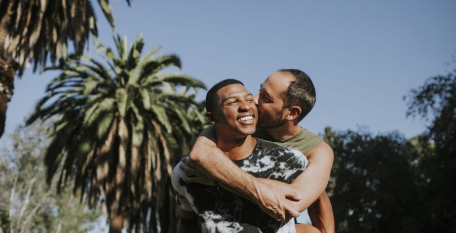 Black man and white man hugging
