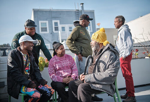 Black Brothers Esteem members gathered together at an SFAF community event